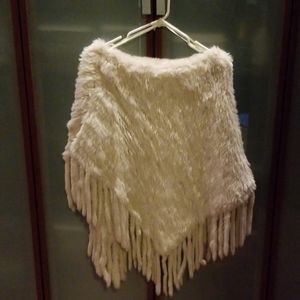 Wilsons I believe it's rabbit or ermine fur poncho